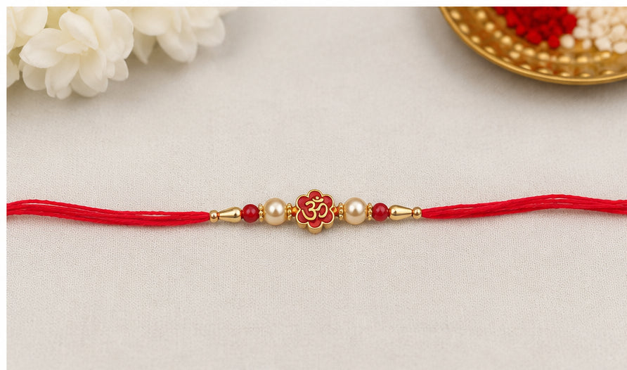Divine Om Pearl Rakhi with Red Beads OMR-RK-3101