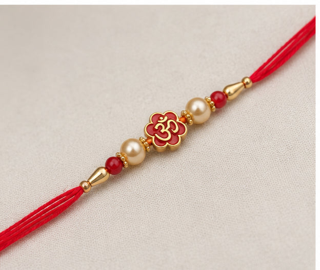 Divine Om Pearl Rakhi with Red Beads OMR-RK-3101