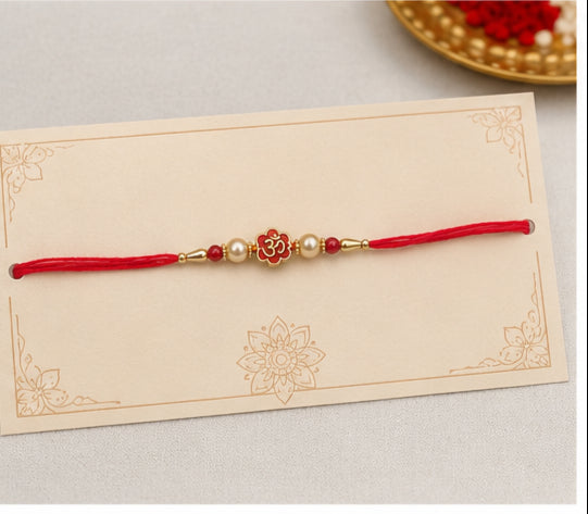 Divine Om Pearl Rakhi with Red Beads OMR-RK-3101