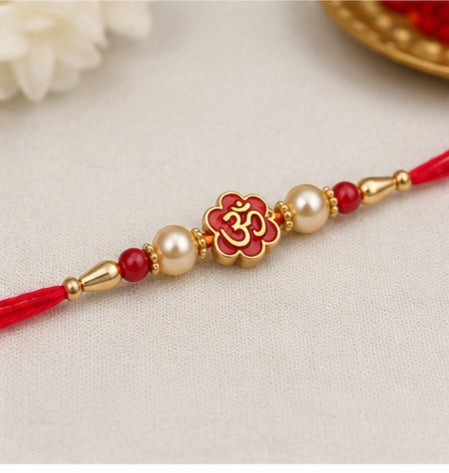 Divine Om Pearl Rakhi with Red Beads OMR-RK-3101