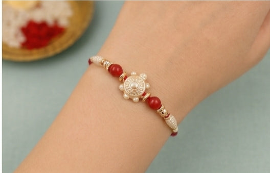 Pearl Aura Designer Rakhi with Red Beads  PAD-RK-3401